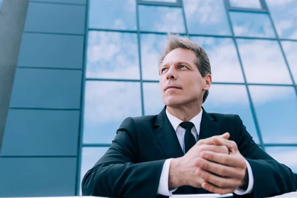 Pensive mature businessman — Stock Photo, Image