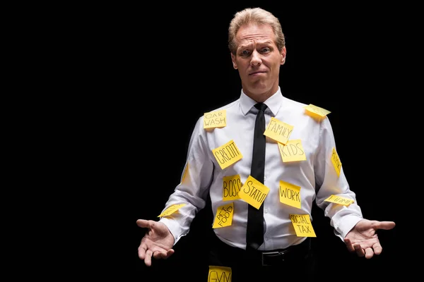 Hombre de negocios estresado con notas adhesivas —  Fotos de Stock