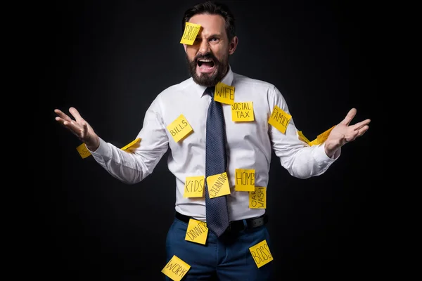 Stressed businessman with sticky notes — Stock Photo, Image