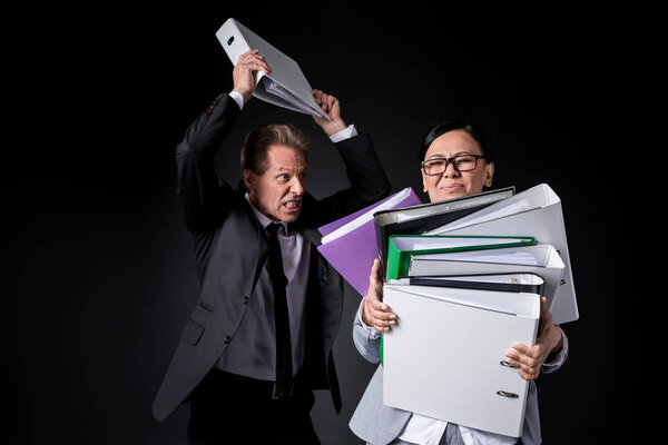 business colleagues with folders
