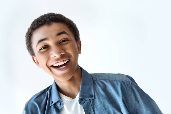 laughing african american teen boy