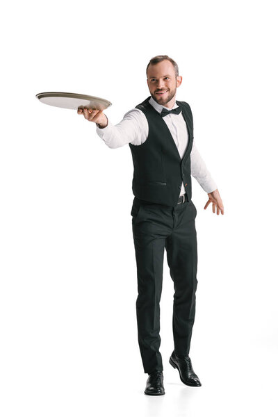 smiling waiter in suit with tray