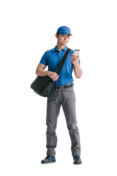 young asian courier with smartphone