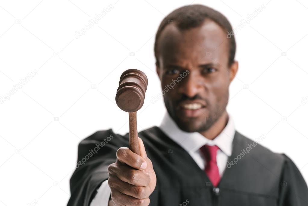 judge pointing at camera with gavel