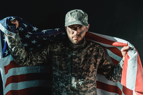 soldier with united states flag