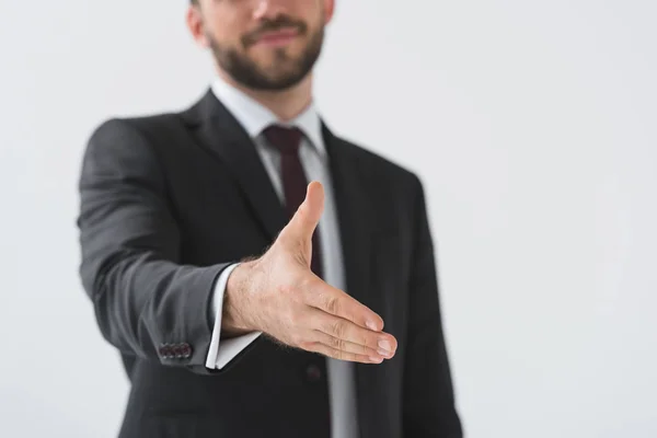 Businessman with outstretched hand — Stock Photo, Image