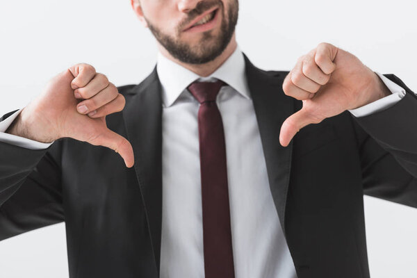 businessman showing thumbs down