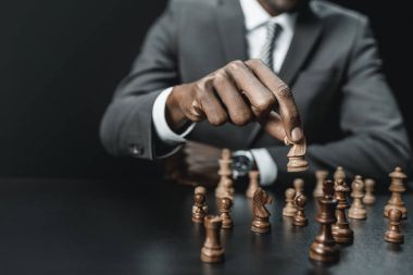 african american businessman playing chess clipart