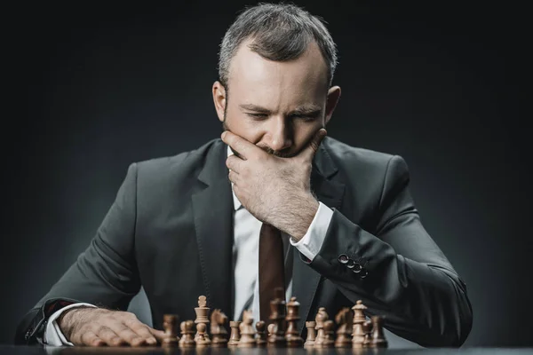 Pensive businessman and chess — Stock Photo, Image