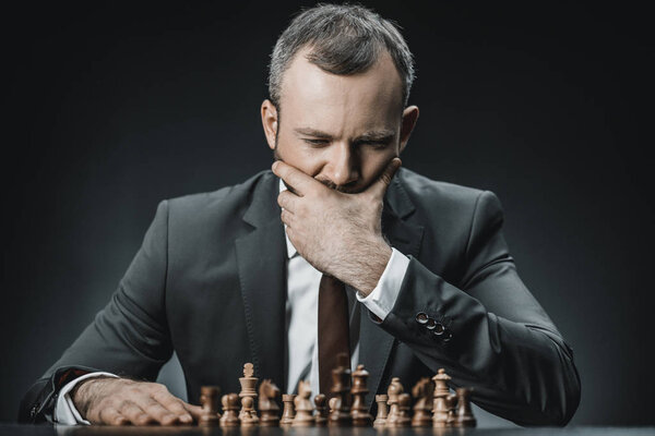 pensive businessman and chess