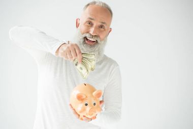 man with dollars and piggy bank clipart