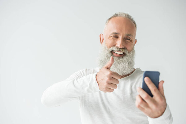 man taking selfie on smartphone