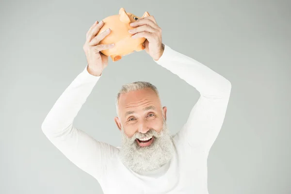 Senior man with piggy bank — Stock Photo, Image