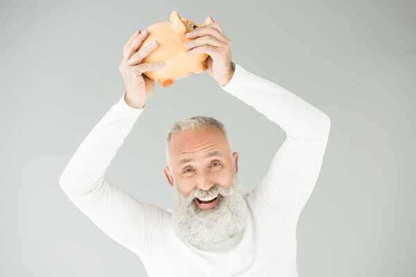 senior man with piggy bank