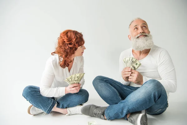 Dreaming couple with dollar banknotes — Stock Photo, Image