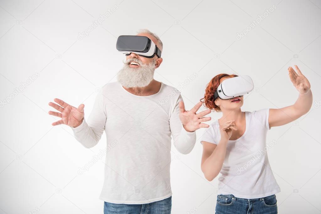 couple using virtual reality headsets