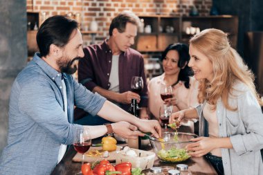 friends preparing dinner together clipart