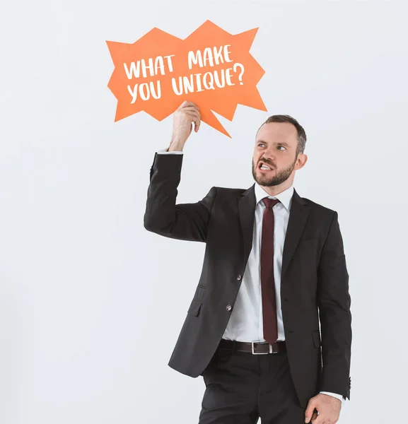 Businessman with card with question — Stock Photo, Image