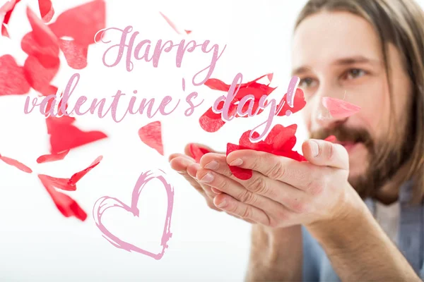 Man blowing paper hearts — Free Stock Photo