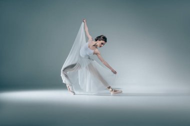 elegant beautiful ballerina dancing in white dress clipart