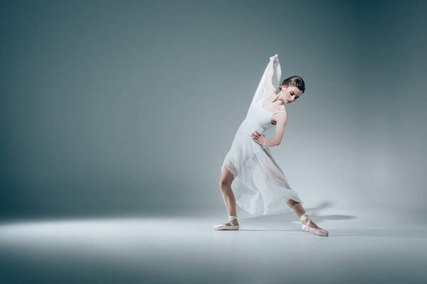 elegant ballet dancer in white dress