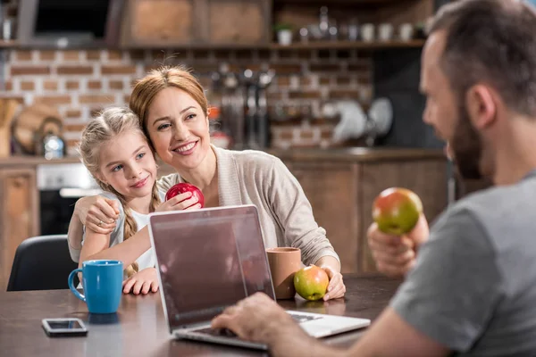 Young family in kitchen — Stock Photo