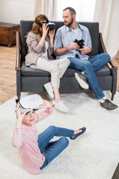 Family in virtual reality headsets — Stock Photo