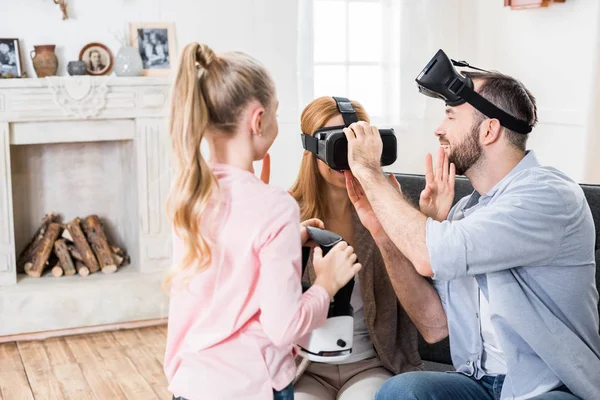 Family in virtual reality headsets — Stock Photo