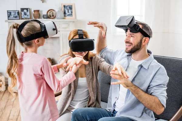 Family in virtual reality headsets — Stock Photo