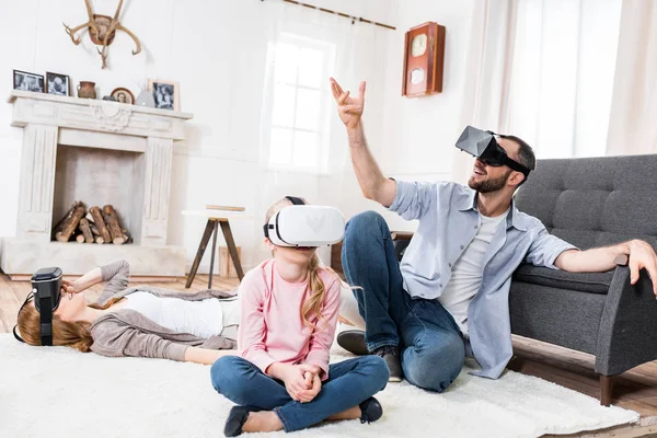 Family in virtual reality headsets — Stock Photo