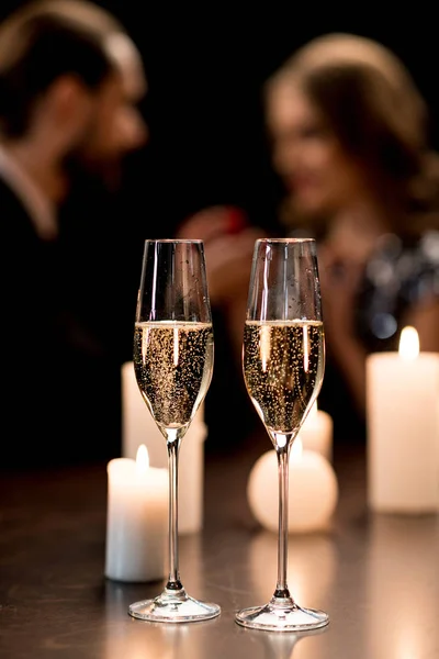 Champagne glasses and candles — Stock Photo