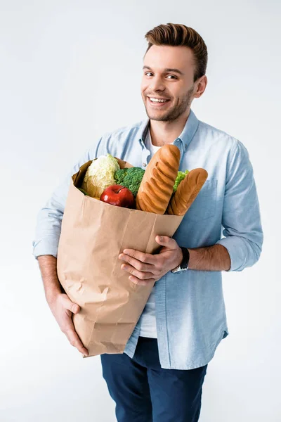 Hombre sosteniendo bolsa de comestibles - foto de stock