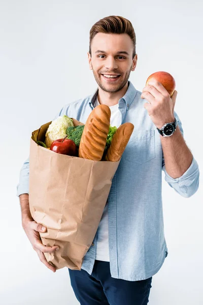 Hombre sosteniendo bolsa de comestibles - foto de stock