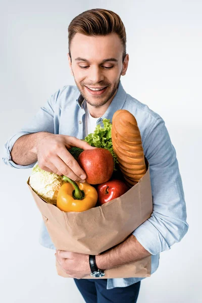 Uomo che tiene la borsa della spesa — Foto stock