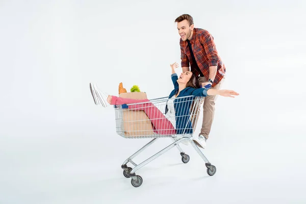 Pareja con carrito de compras - foto de stock