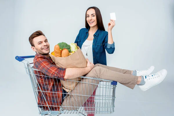 Couple with shopping cart — Stock Photo