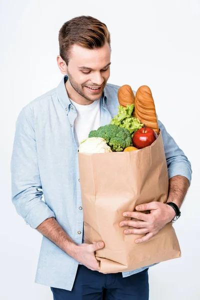 Hombre sosteniendo bolsa de comestibles - foto de stock