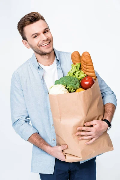 Hombre sosteniendo bolsa de comestibles - foto de stock