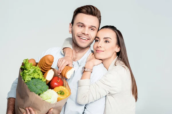 Couple with grocery bag — Stock Photo