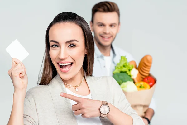 Woman holding credit card — Stock Photo