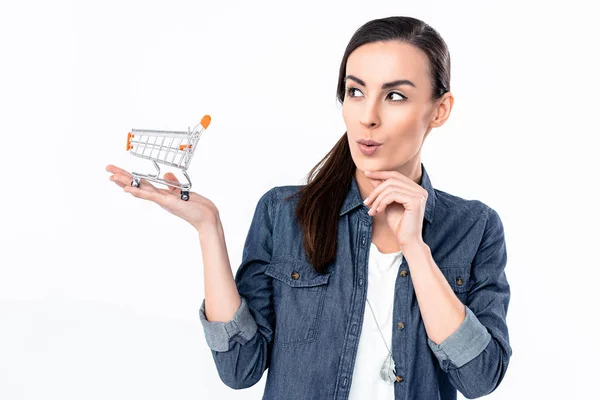 Woman holding shopping cart model — Stock Photo