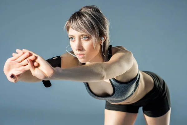 Sporty woman stretching — Stock Photo