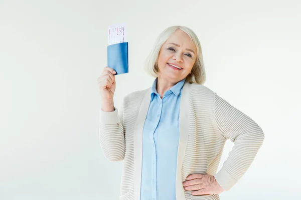 Senior woman with passports and tickets — Stock Photo