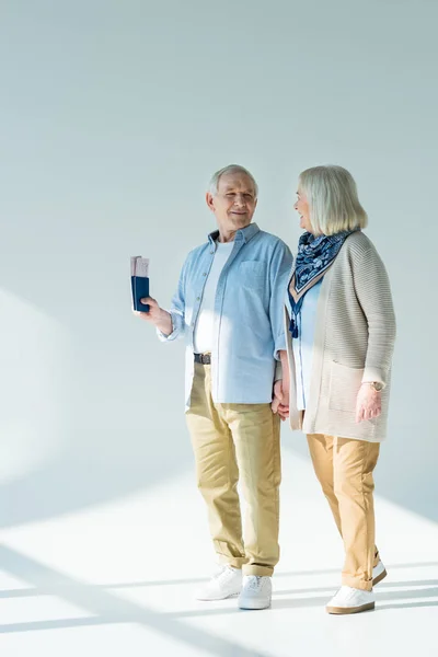 Senior couple with passports and tickets — Stock Photo