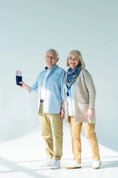 Senior couple with passports and tickets — Stock Photo