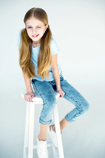 Girl sitting on chair — Stock Photo
