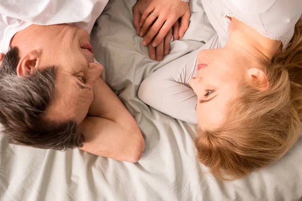 Mature couple in bed — Stock Photo