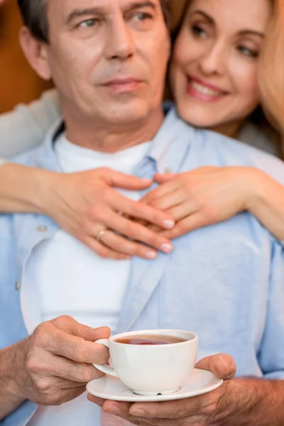 Mature couple with tea — Stock Photo