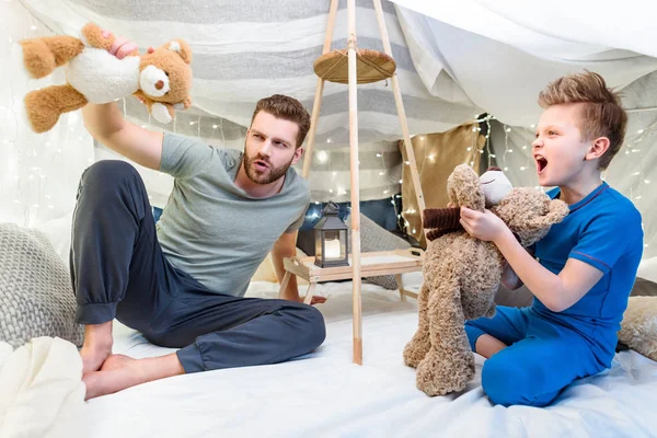 Father and son in blanket fort — Stock Photo