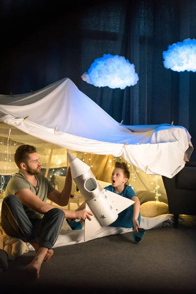 Father and son in blanket fort — Stock Photo
